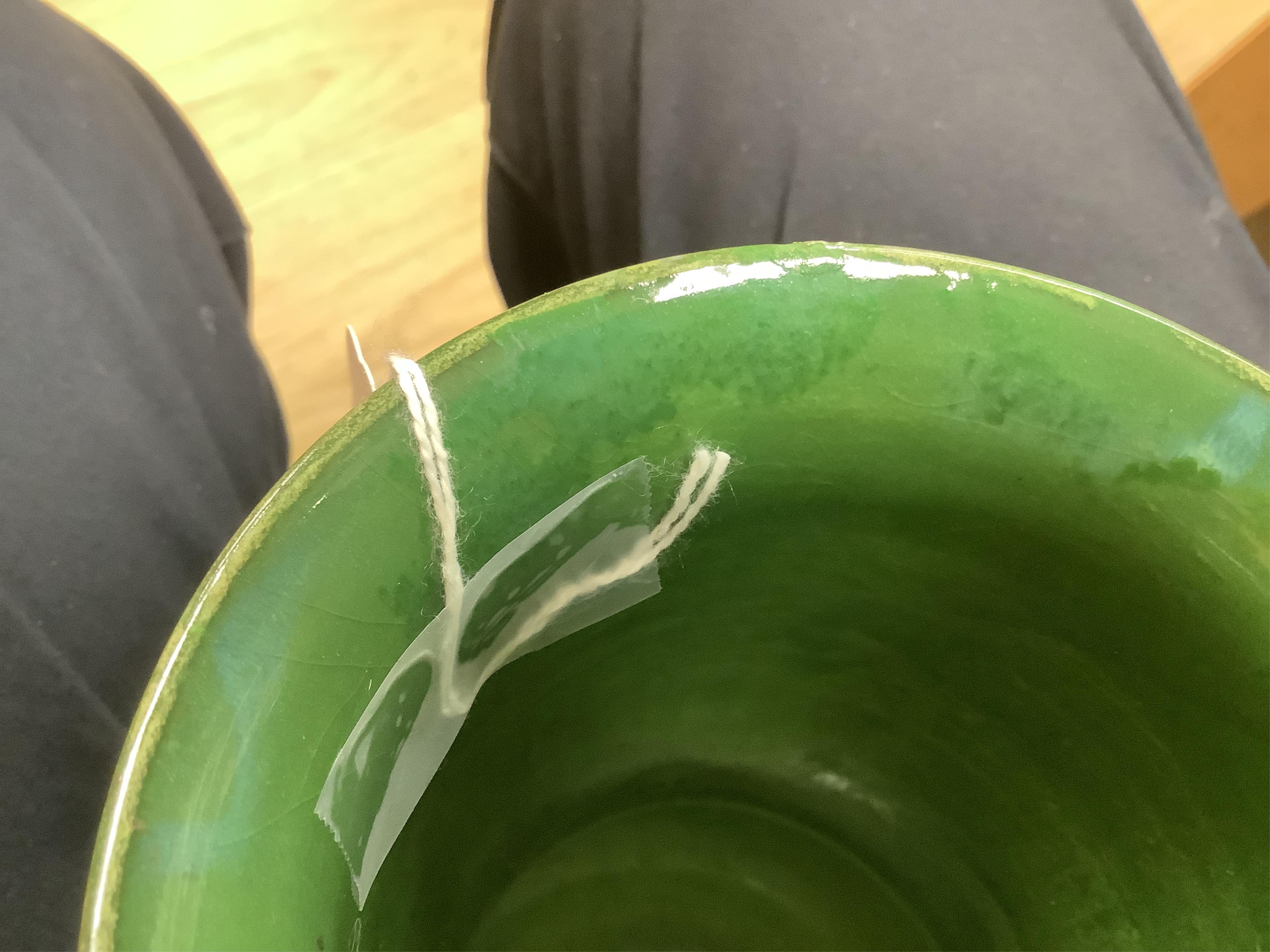 A Moorcroft for Liberty & Co. Flamminion Ware vase, and a smaller Moorcroft vase glazed in a mottled plum flambe, the first 20cm., also to include two Moorcroft reference books